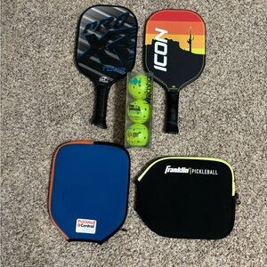 Set of 2 pickle ball paddles, 2 covers, and 3 balls